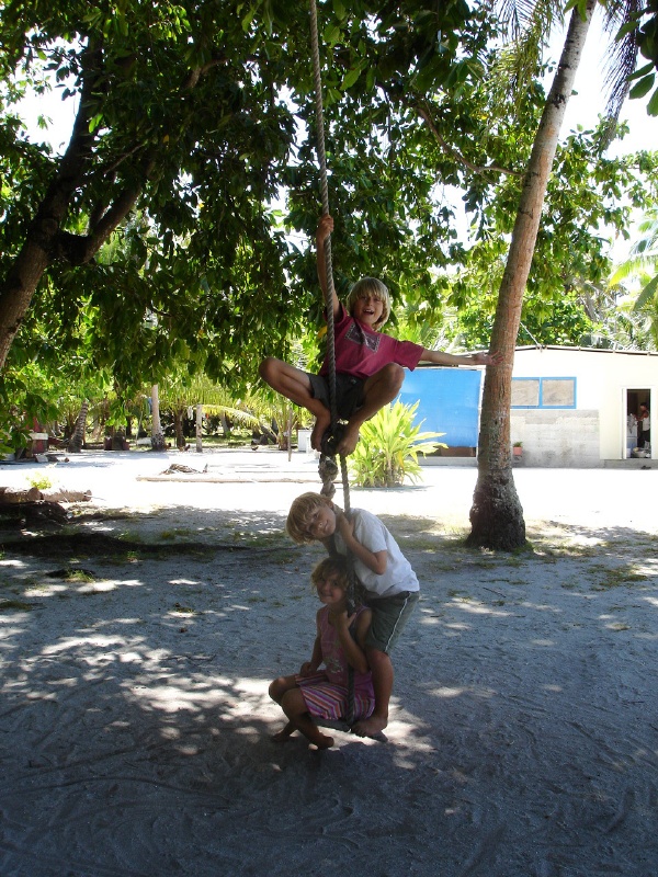 Tristan, Matthew & Abby give the swing a go.